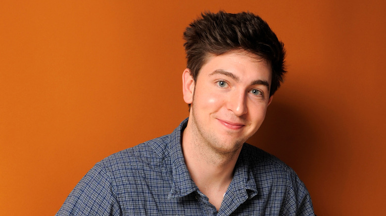 Nicholas Braun smirking