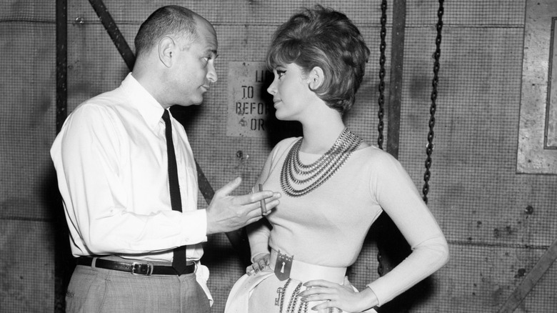 Norman Lear and Jill St. John talking on the set of Come Blow Your Horn