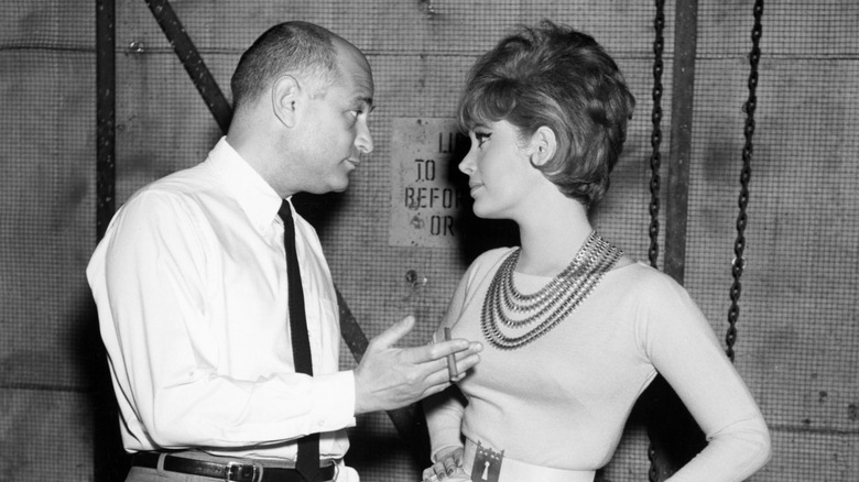 Norman Lear and Jill St. John talking on the set of Come Blow Your Horn