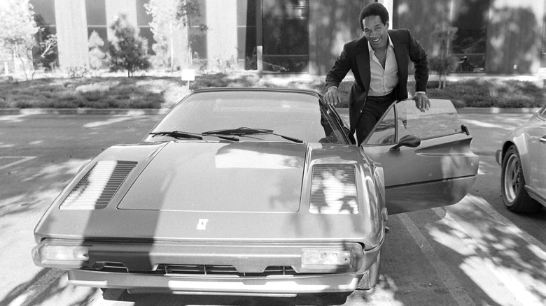 O.J. Simpson poses with his Ferrari