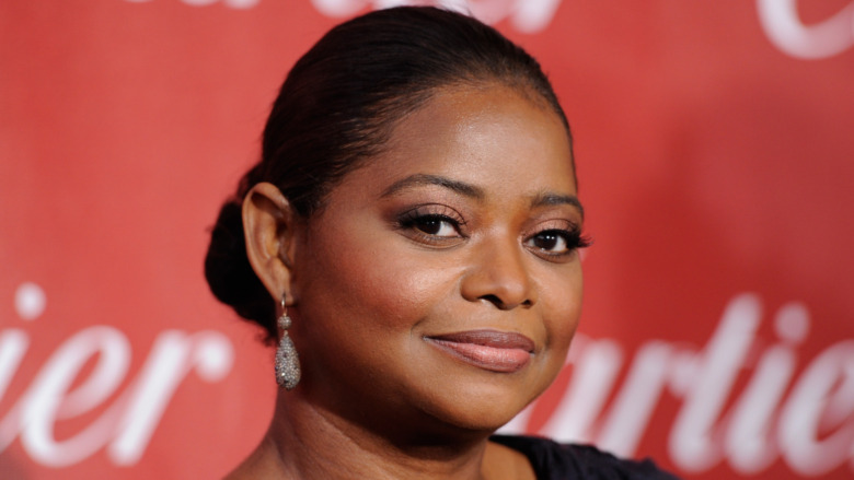 Octavia Spencer smiling slightly