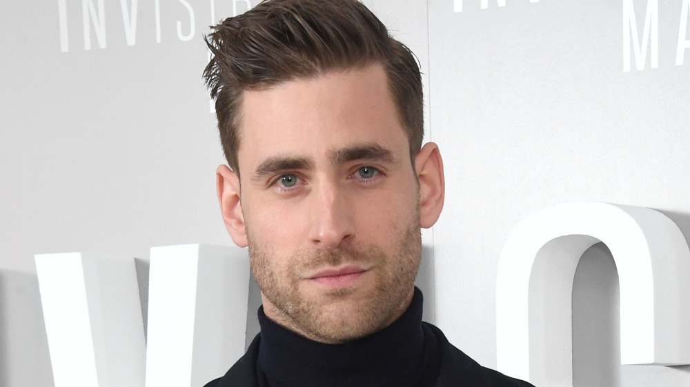 Oliver Jackson-Cohen posing