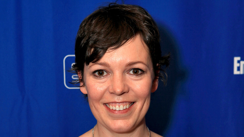 Olivia Colman smiling at the Tyrannosaur premiere