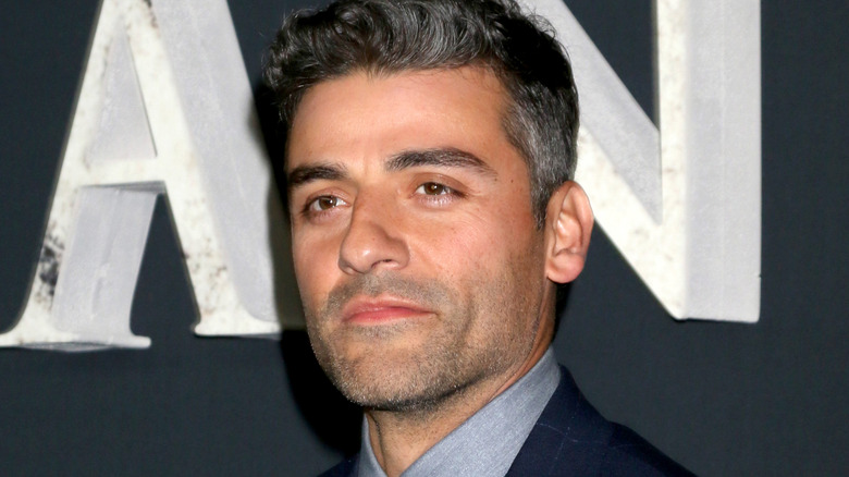 Oscar Isaac in a suit