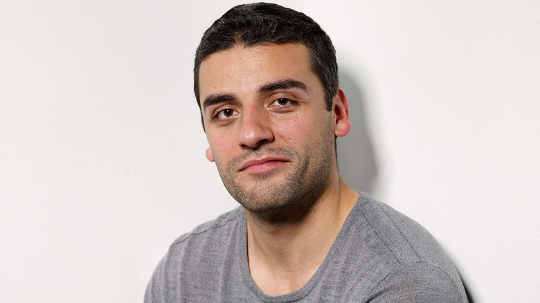 Oscar Isaac looks at camera