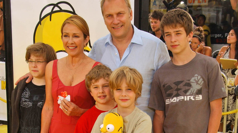 Patricia Heaton and family posing at The Simpsons Movie premiere