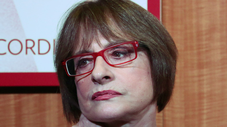Patti LuPone wearing red glasses