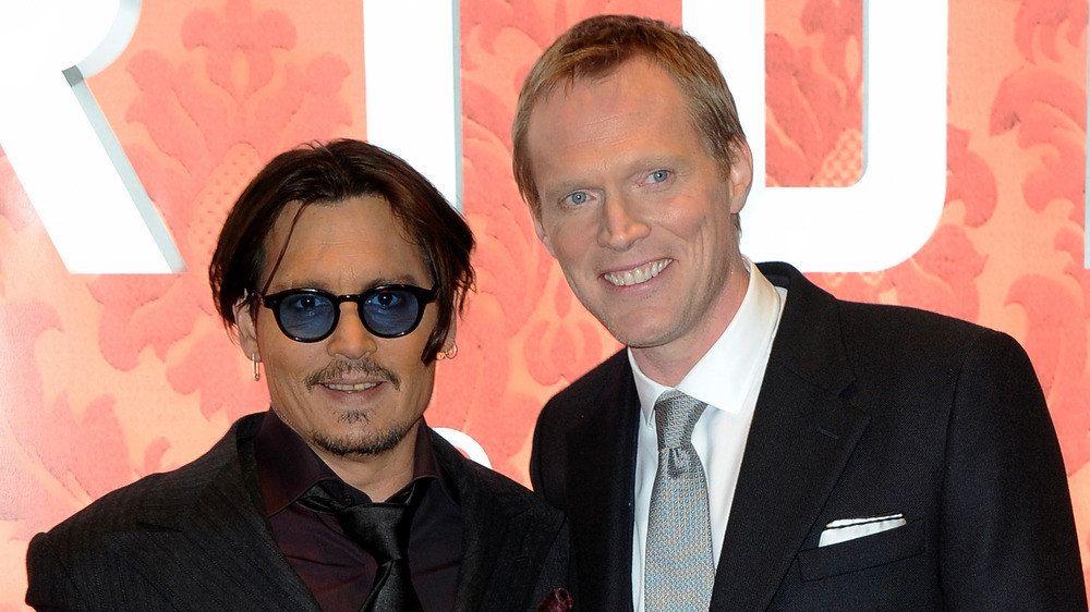 Johnny Depp and Paul Bettany smiling at the UK Premiere of Mortdecai
