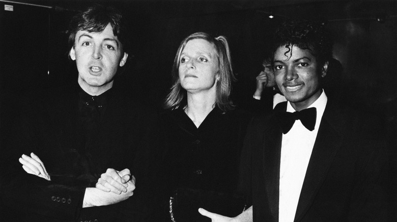 Paul McCartney, Michael Jackson, and Linda McCartney, all posing