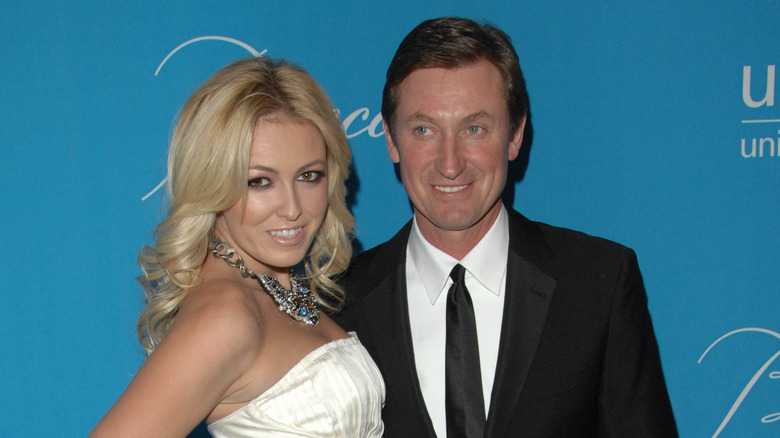 Paulina Gretzky and Wayne Gretzky smiling