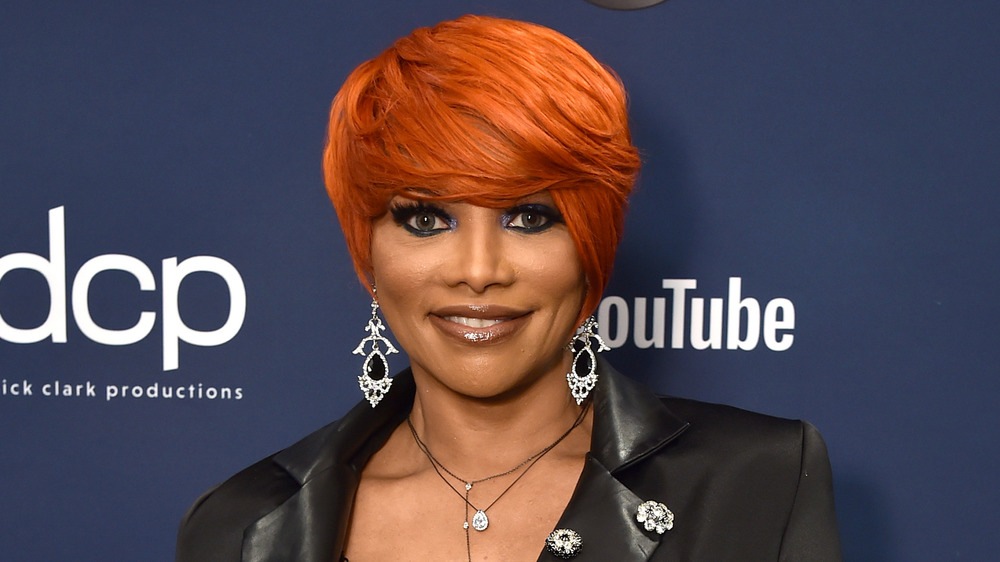 Sandra "Pepa" Denton smiling on the red carpet