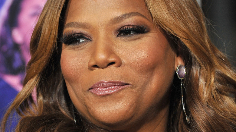 Queen Latifah smirking