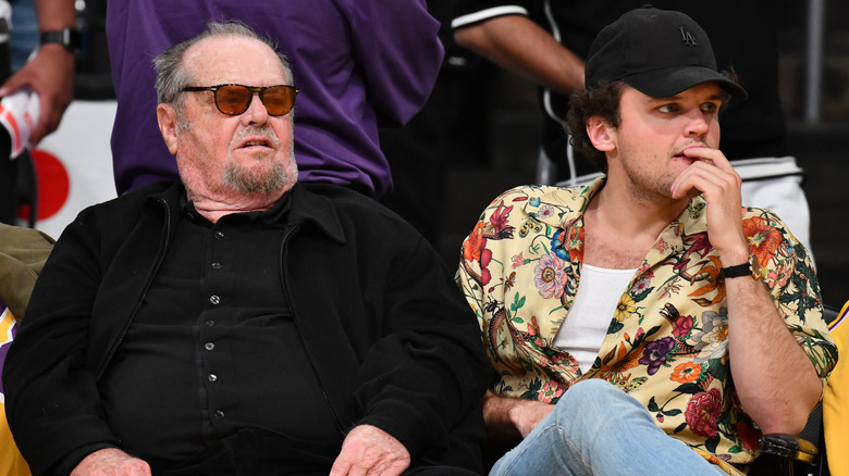 Ray and Jack Nicholson watch a basketball game together