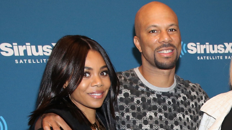 Regina Hall and Common smiling