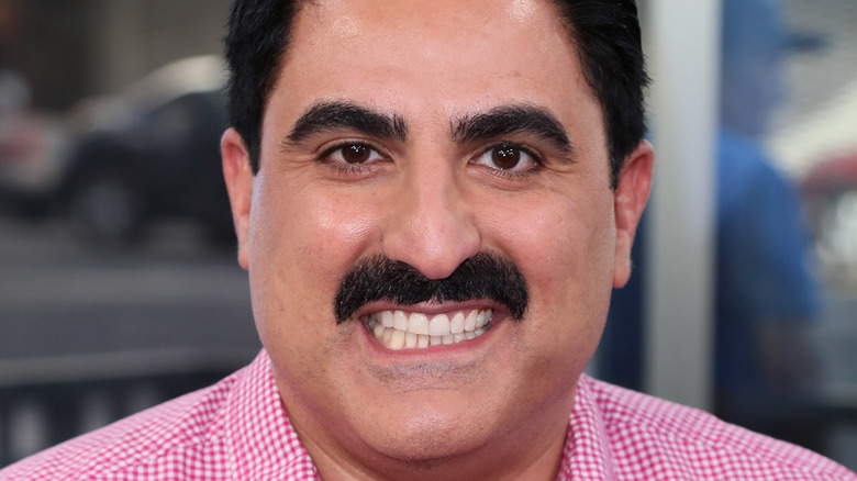 Reza Farahan posing for cameras