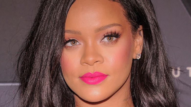 Rihanna wearing bright pink lipstick 