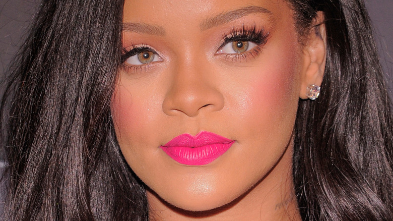 Rihanna wearing bright pink lipstick 