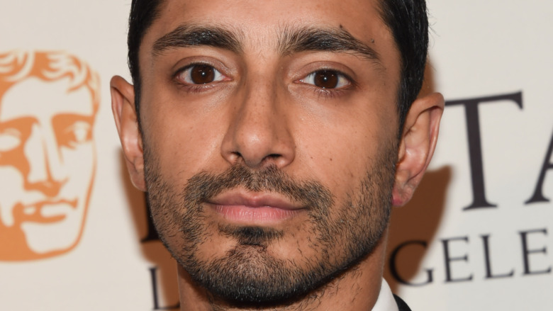 Riz Ahmed with a serious expression