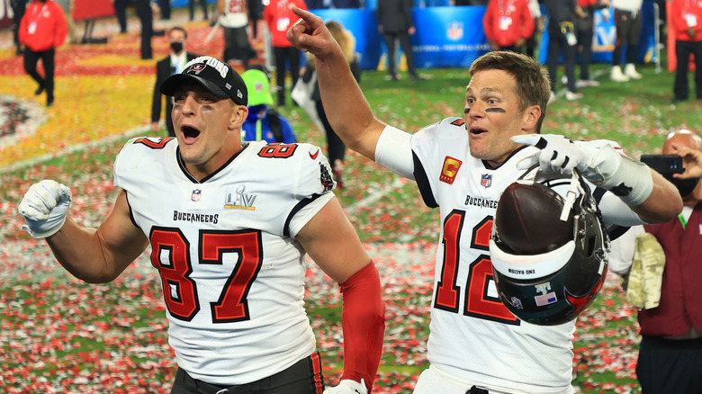 Rob Gronkowski and Tom Brady celebrating on the field