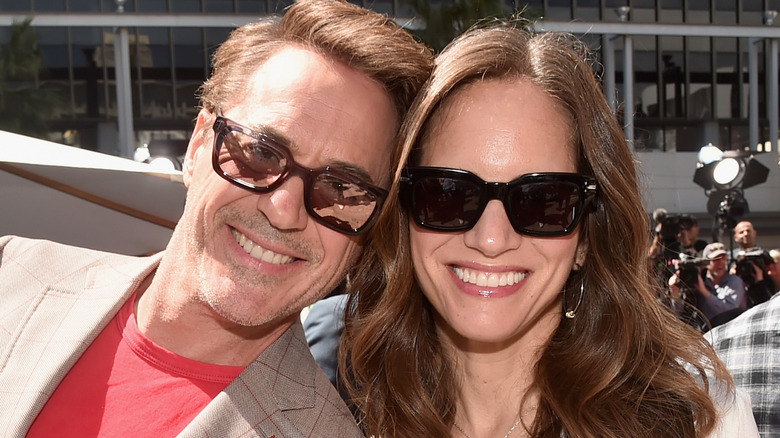 Robert Downey Jr. and Susan Downey wearing sunglasses