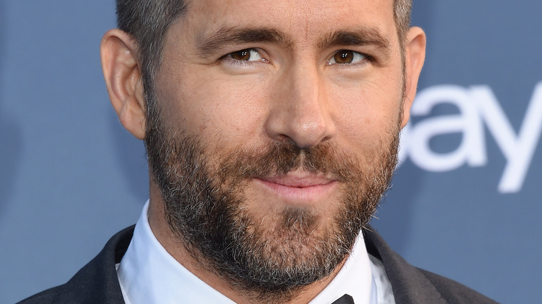 Ryan Reynolds in a tuxedo, smiling
