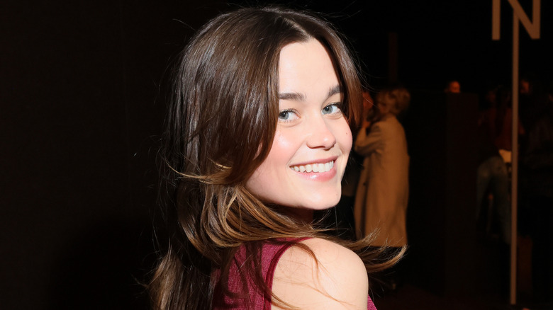 Sarah Catherine Hook smiling with people in the background