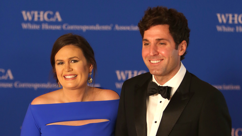 Sarah Huckabee Sanders at a red carpet event with husband Bryan Sanders