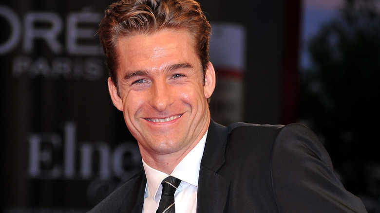 Scott Speedman smiling wearing a tie
