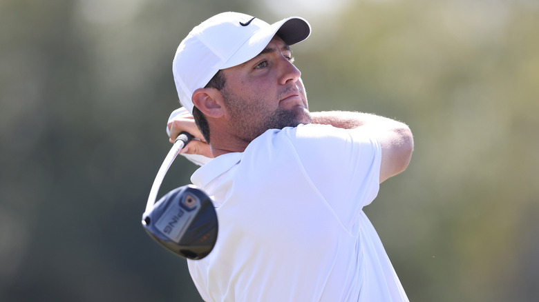 Scottie Scheffler swinging a golf club