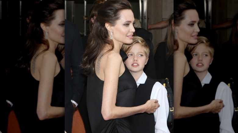 Angelina Jolie hugging Shiloh Jolie-Pitt