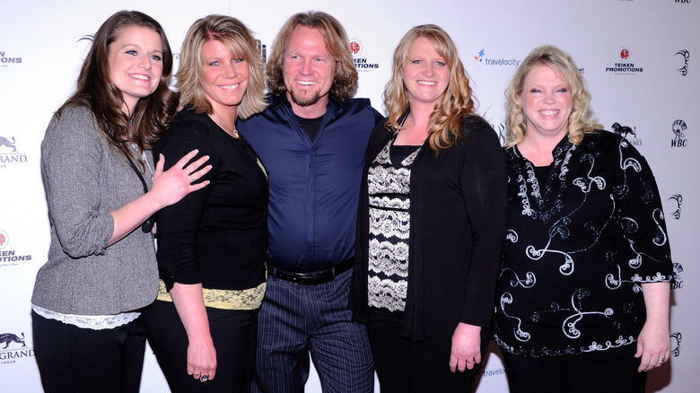 Christine Brown smiling with Kody and Sister Wives