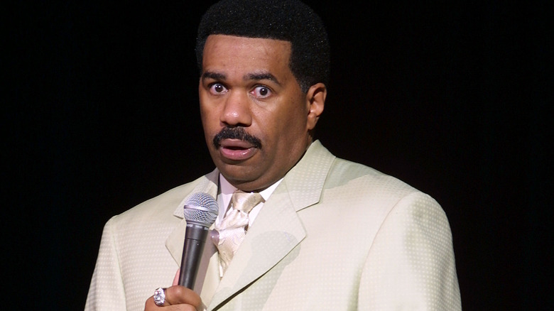 Steve Harvey onstage performing standup comedy