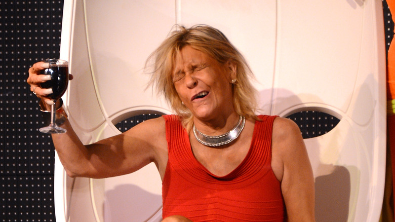 Patricia 'Tan Mom' Krentcil posing with a glass of wine
