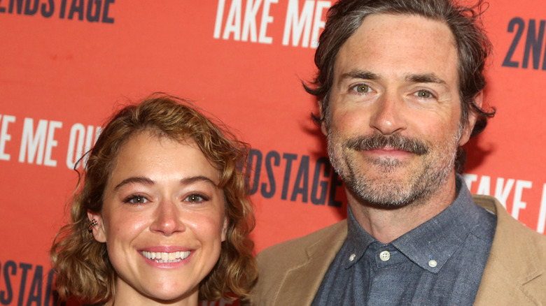 Tatiana Maslany and Brendan Hines smiling at event