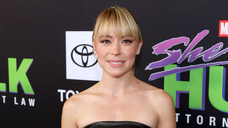 Tatiana Maslany against She-Hulk backdrop
