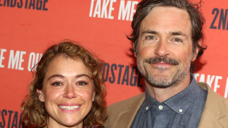 Tatiana Maslany and Brendan Hines smiling at event