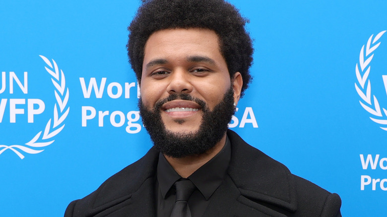 The Weeknd smiling peat coat