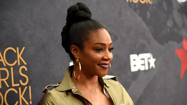 Tiffany Haddish smiling on the red carpet