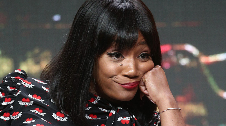 Tiffany Haddish smirking