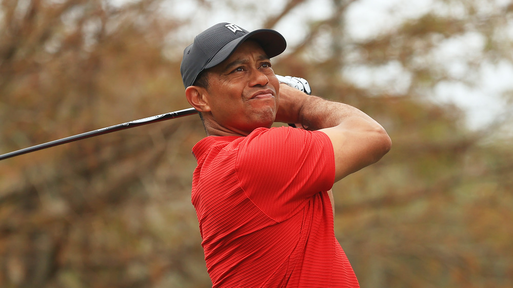 Tiger Woods taking a swing on the golf course