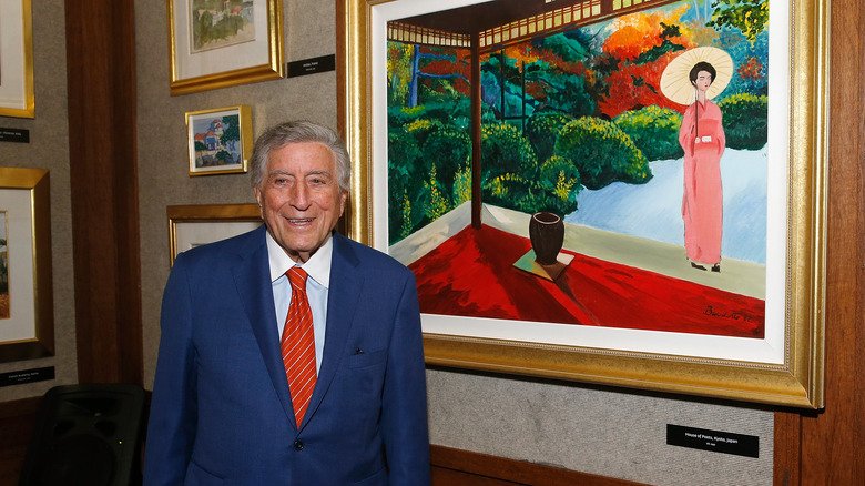 Tony Bennett with his paintings