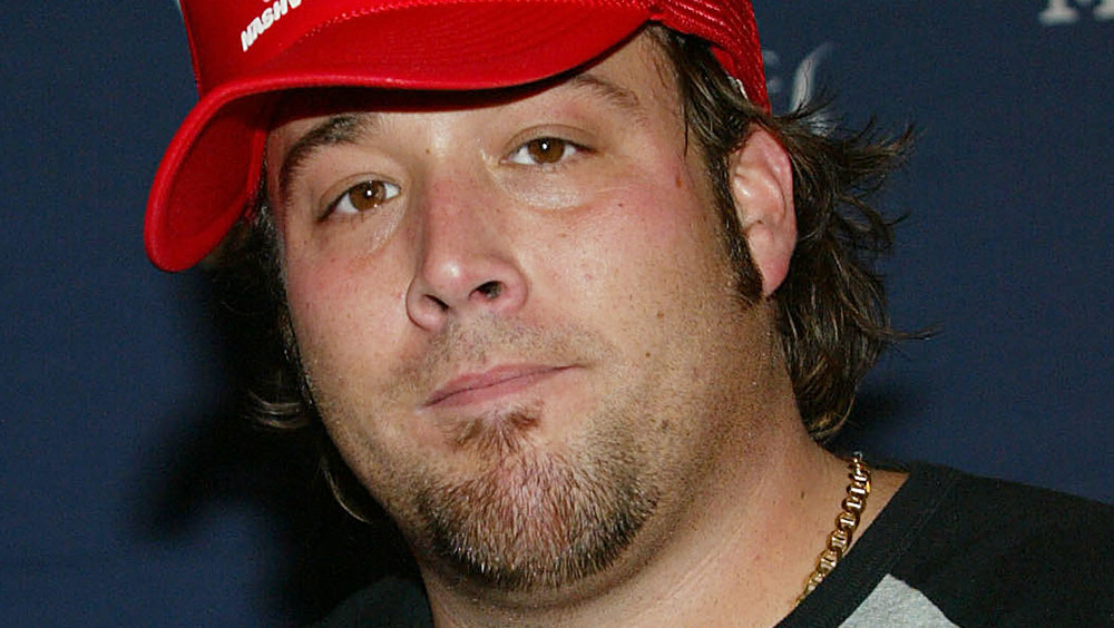 Uncle Kracker in a red trucker hat