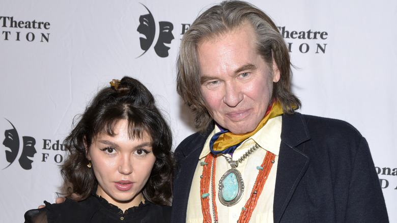 Val Kilmer striking a pose with his daughter Mercedes at an event