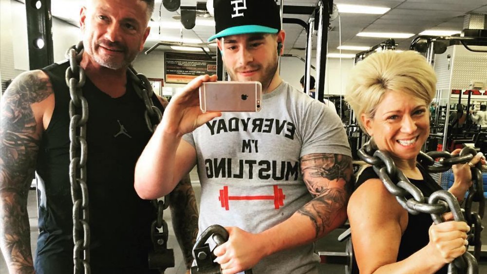 Larry Caputo, Larry Caputo, Jr., and Theresa Caputo posing in the weight room for an Instagram selfie