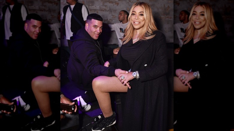 Wendy Williams posing at a Diesel event in sneakers