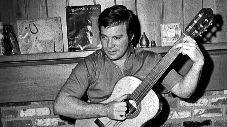 William Shatner playing guitar