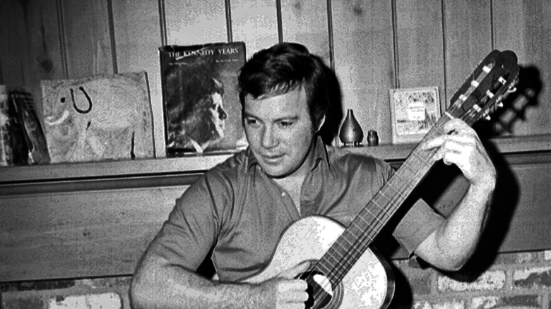 William Shatner playing guitar