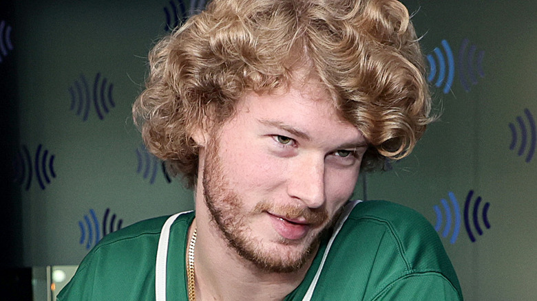 Yung Gravy in green shirt and curly hair