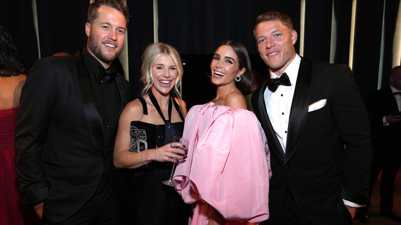 Matthew Stafford, Kelly Hall, Olivia Culpo, Christian McCaffrey smiling