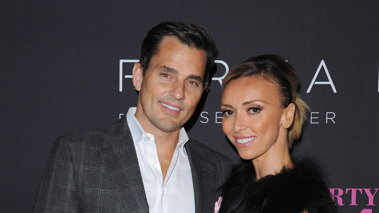 Bill Rancic, wearing a gentle smile, leans toward a radiant Giuliana Rancic.